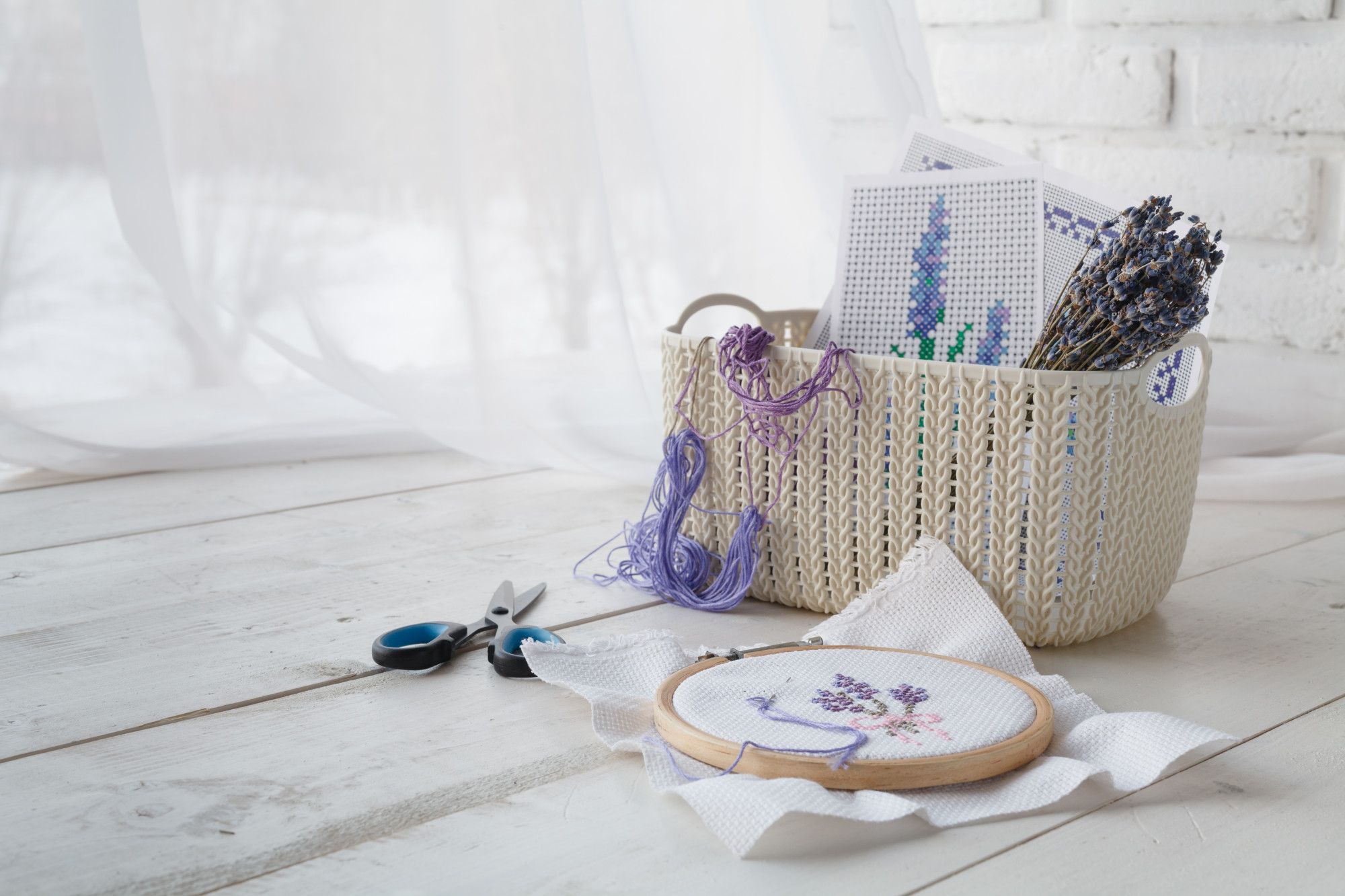 Large editorial shot of embroidered linen product on wooden table